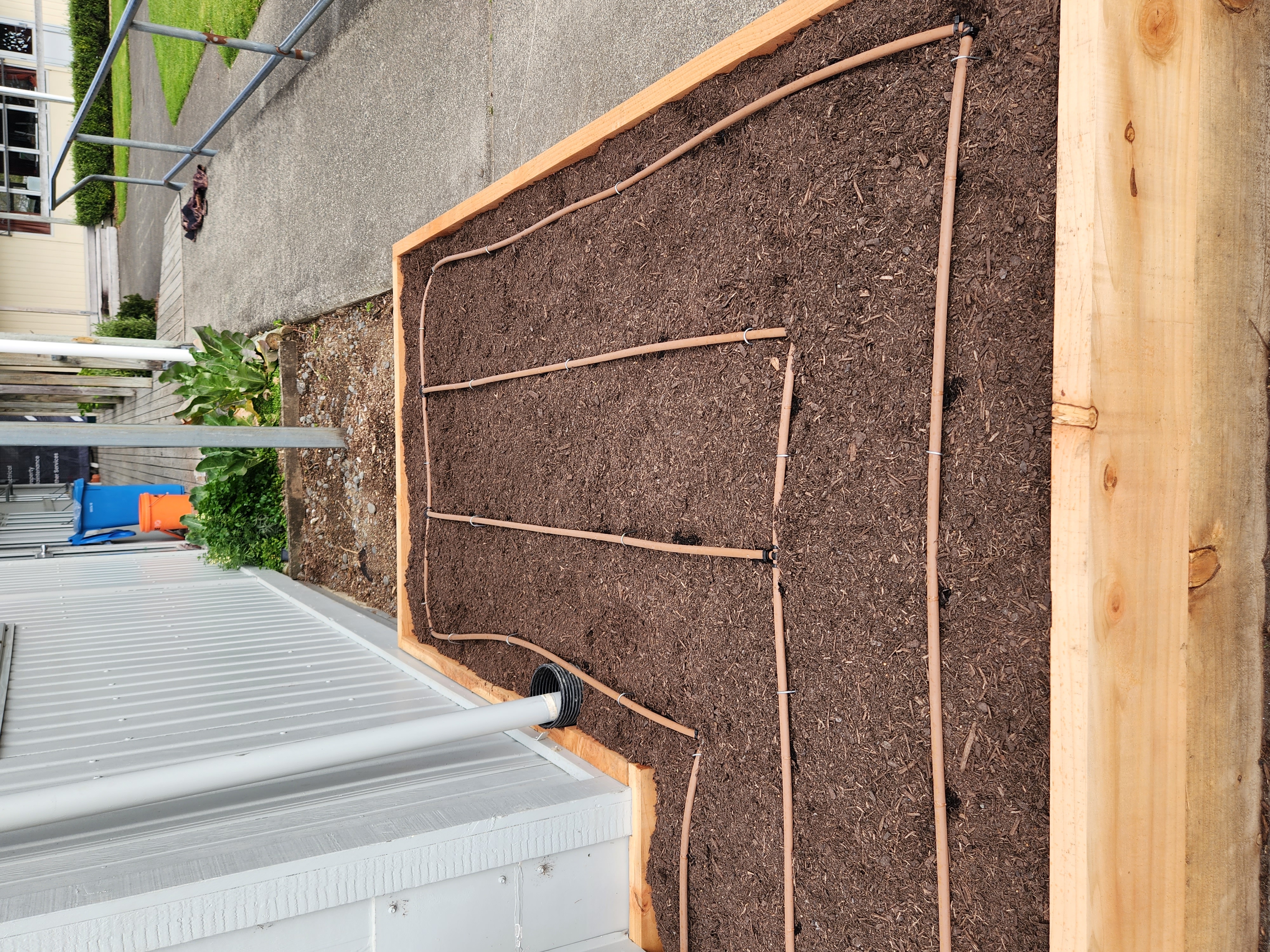 Preparing compost and soil amendments for a new garden bed