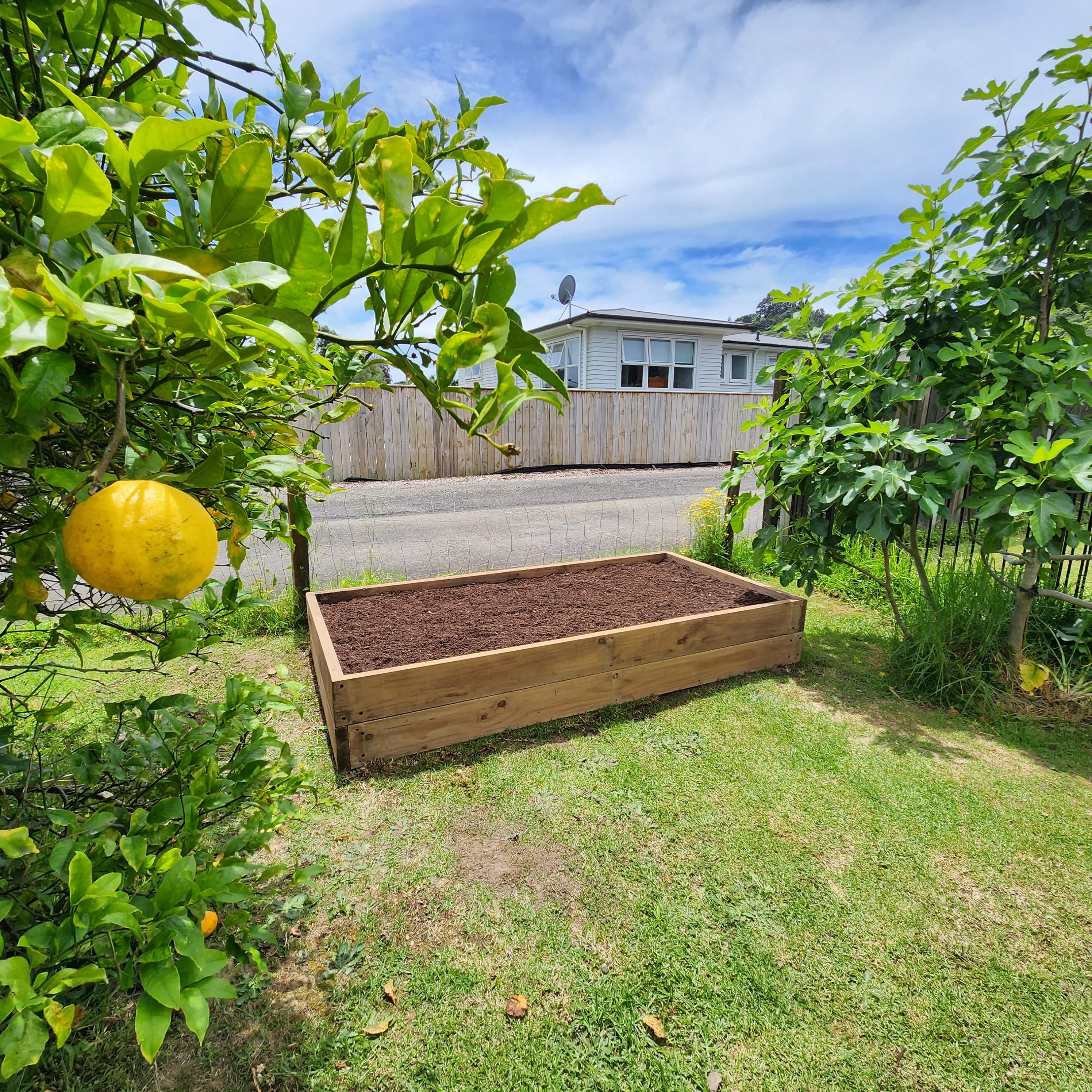 Team installing a timber raised garden bed thumbnail